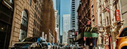 vehicles-on-road-between-buildings