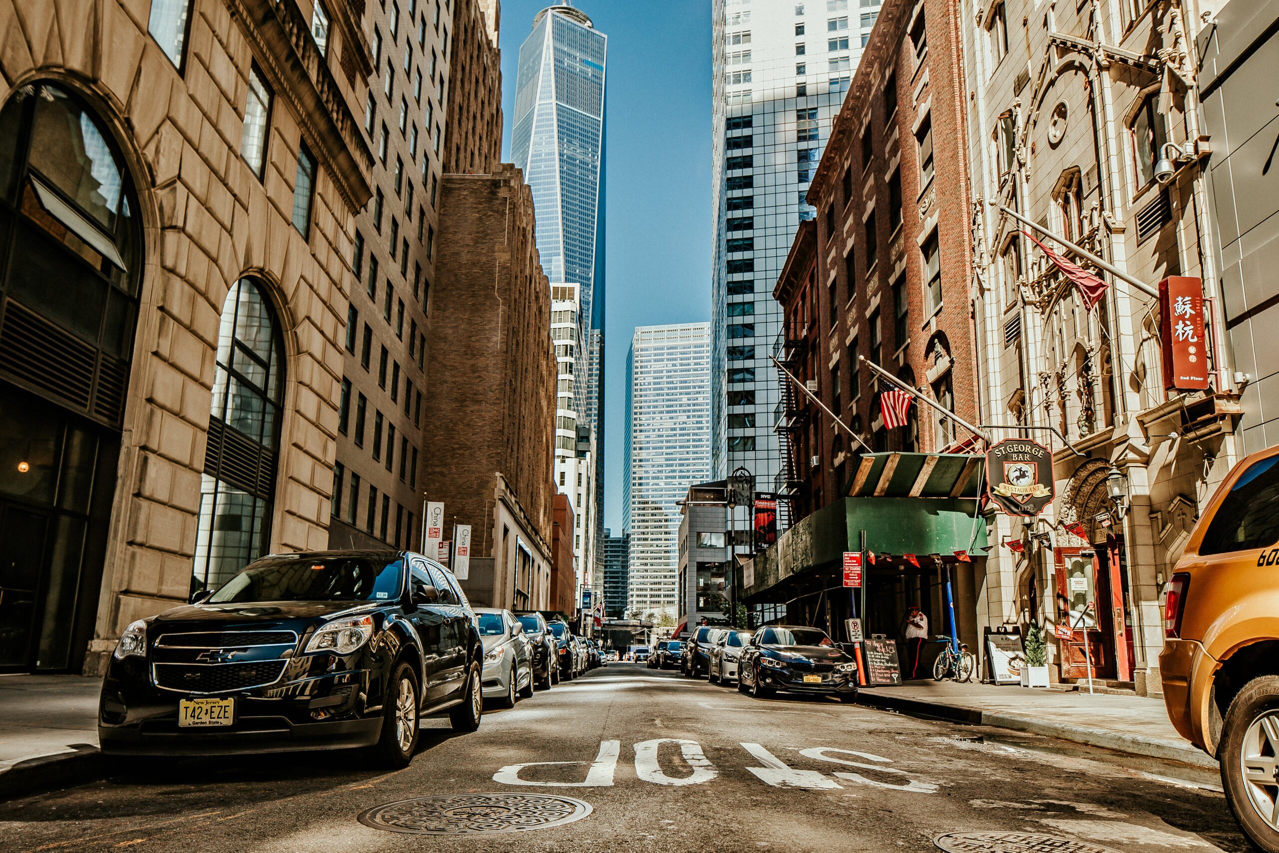 vehicles-on-road-between-buildings
