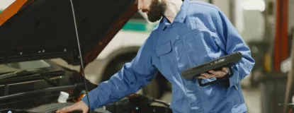 mechanic-checking-the-engine-of-a-car